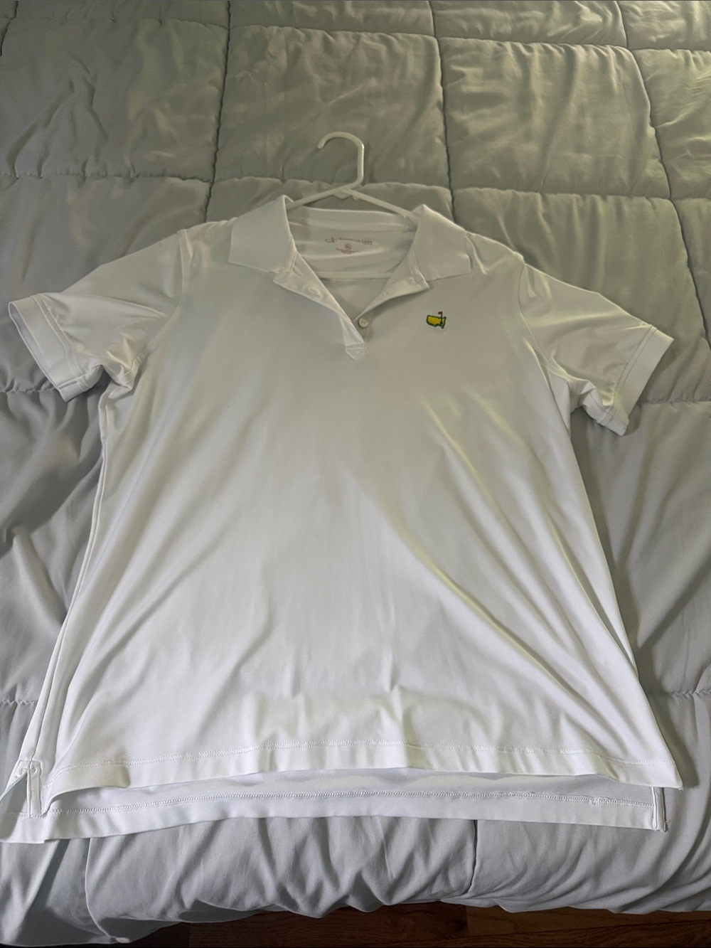 Women’s White Polo Shirt with Small Yellow Logo